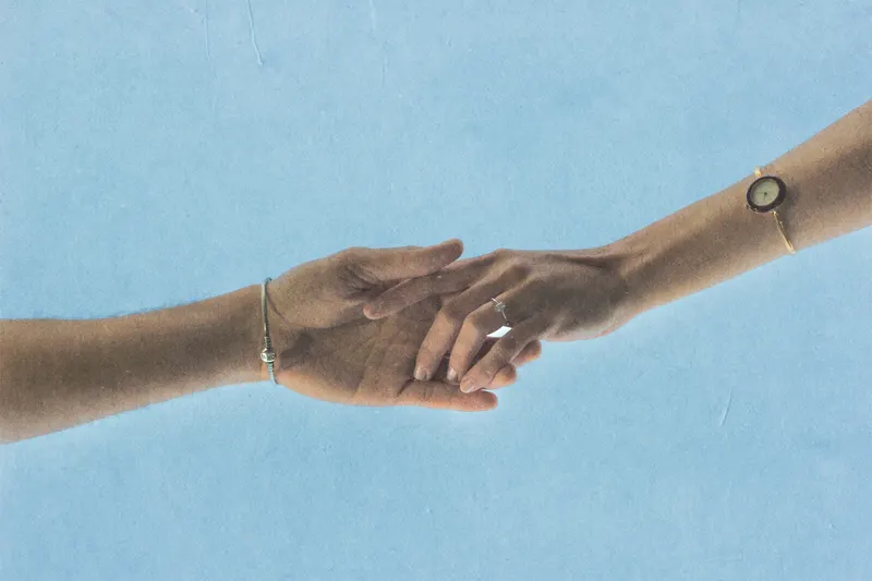 Christian and Kristine’s hands, rings showing